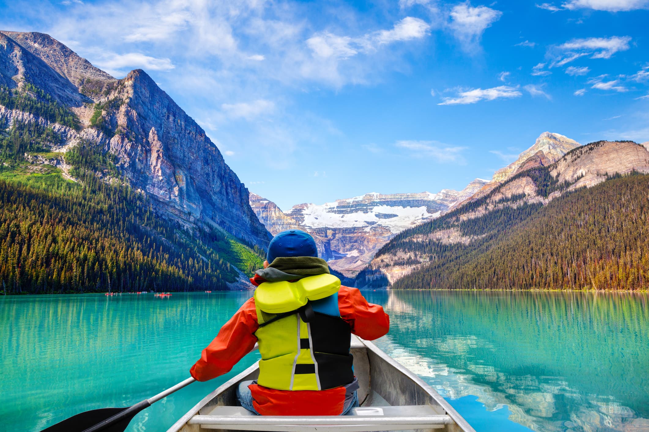 Paddling into a turquoise glacier lake